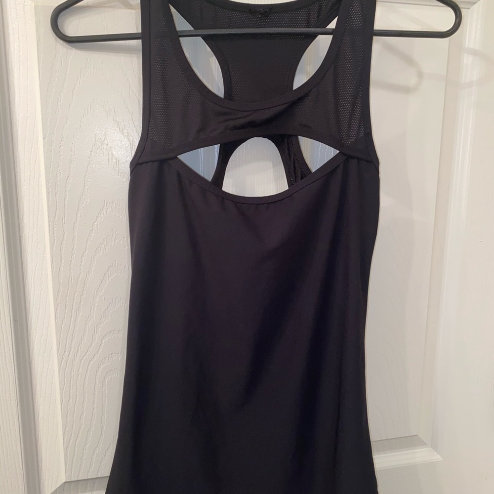 The tags are cut off of this top, looks like a S